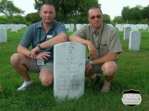 While in San Antonio to attend the annual convention of the 99th Infantry Division Association, Seel (left) and Speder visited Lt Holloway's grave at Fort Sam Houston military cemetery.